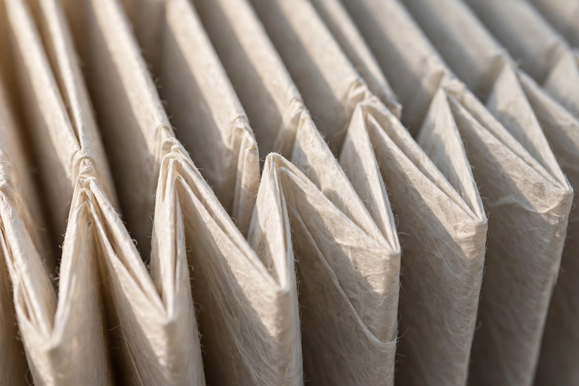 Close-up texture of a clean pleated air filter